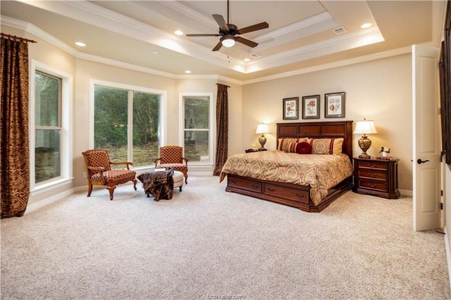 Bedroom with ornamental molding, recessed lighting, visible vents, and light colored carpet | Image 16