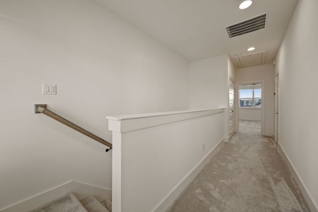 Corridor with attic access, light colored carpet, baseboards, visible vents, and recessed lighting | Image 25