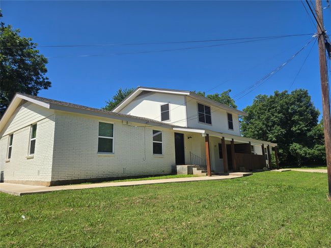 View of front of property featuring brick siding, covered porch, and a front lawn | Image 15