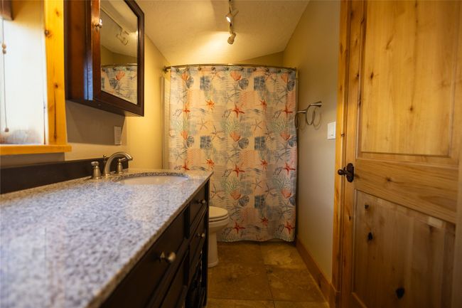 Bathroom with vanity, rail lighting, and a shower with curtain | Image 20