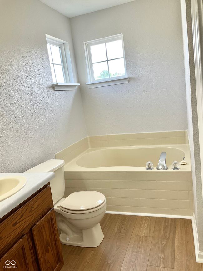 Primary bath has dual vanities, fresh paint and new flooring. | Image 23