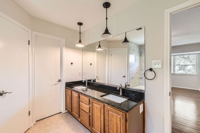 Full bath featuring a sink, double vanity, and visible vents | Image 18