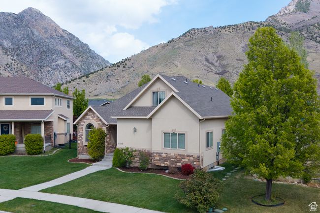 View of front of property with stucco siding, a mountain view, and stone siding | Image 29
