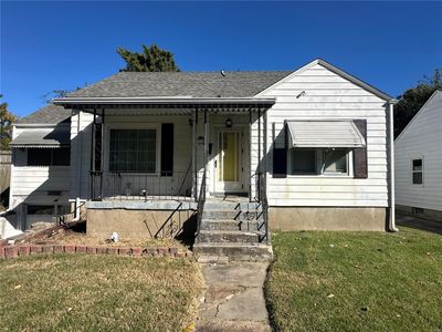 Bungalow with a porch and a front lawn | Image 2