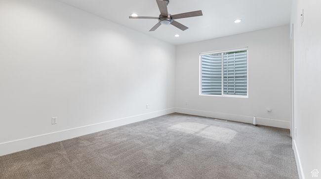 Unfurnished room featuring baseboards, carpet flooring, recessed lighting, and ceiling fan | Image 64