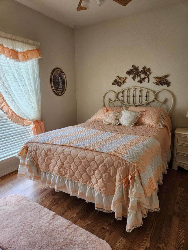 Bedroom featuring wood finished floors | Image 13