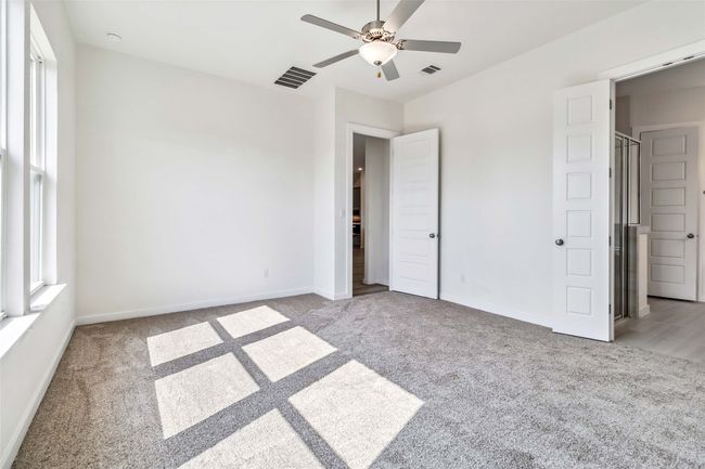 Unfurnished bedroom with carpet flooring and ceiling fan | Image 26