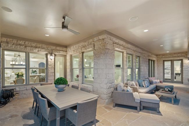 View of patio with an outdoor hangout area, french doors, and ceiling fan | Image 30