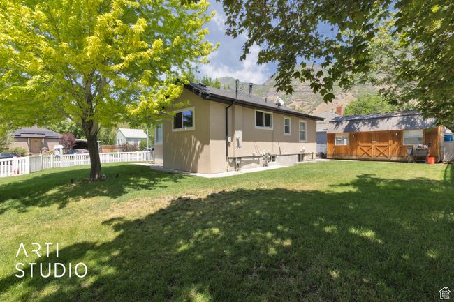 Rear view of property with stucco siding | Image 12