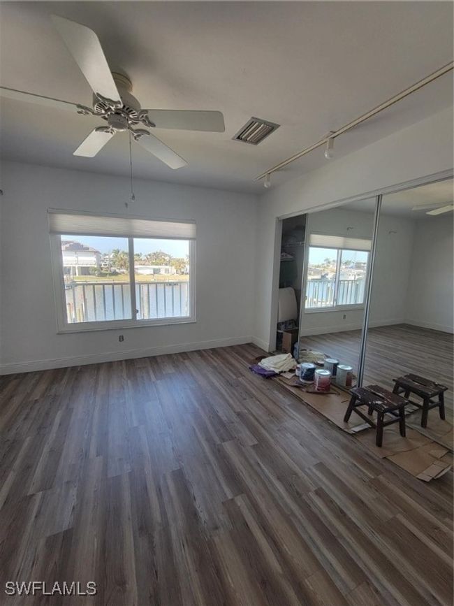 Empty room featuring visible vents, plenty of natural light, baseboards, and wood look vinyl floors | Image 18