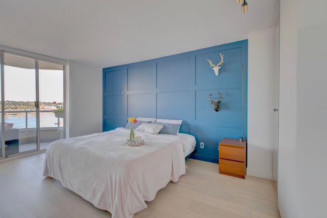 Bedroom featuring a decorative wall, access to exterior, and light wood-style flooring | Image 15