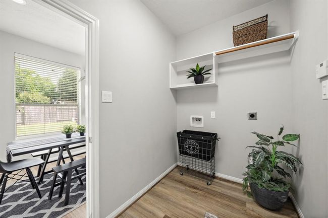 Downstairs utility room leading into breakfast room. | Image 32