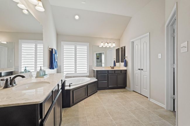 This expansive bathroom offers the potential for a personal spa retreat, an efficient daily routine, or a serene space for relaxation and self-care. | Image 24