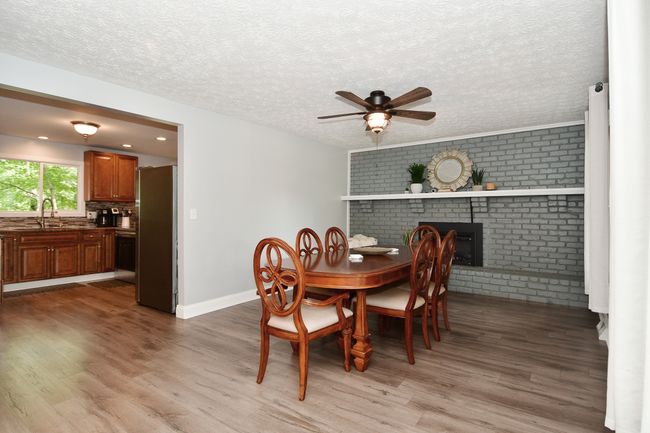 Foyer leading to dining room & kitchen on circular floor plan | Image 10