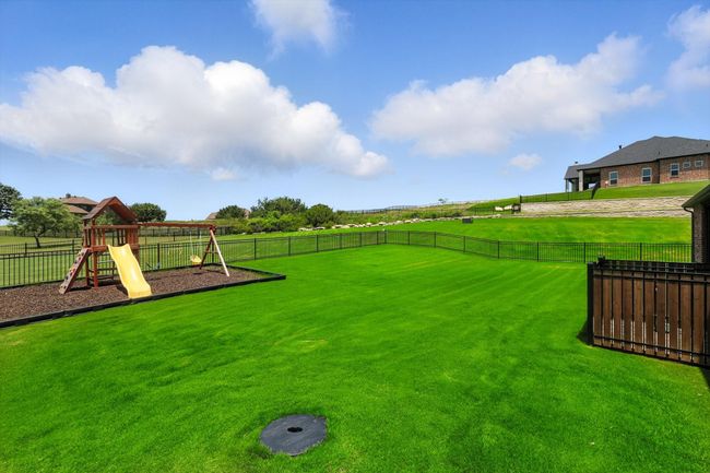View of yard with a playground | Image 38