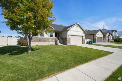 View of front of home featuring a garage and a front lawn | Image 2