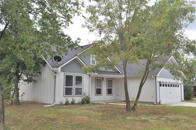 View of front of house with a garage and a front lawn | Image 2