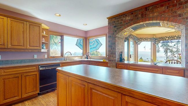 Kitchen featuring wood cabinets | Image 12