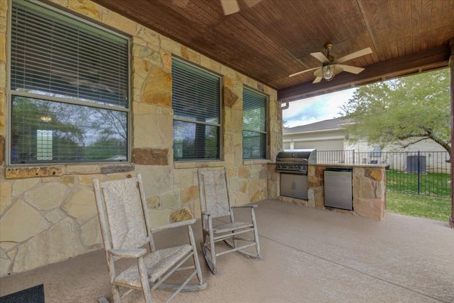 Relax on the Covered patio and enjoy the afternoon shade and view of pool | Image 37