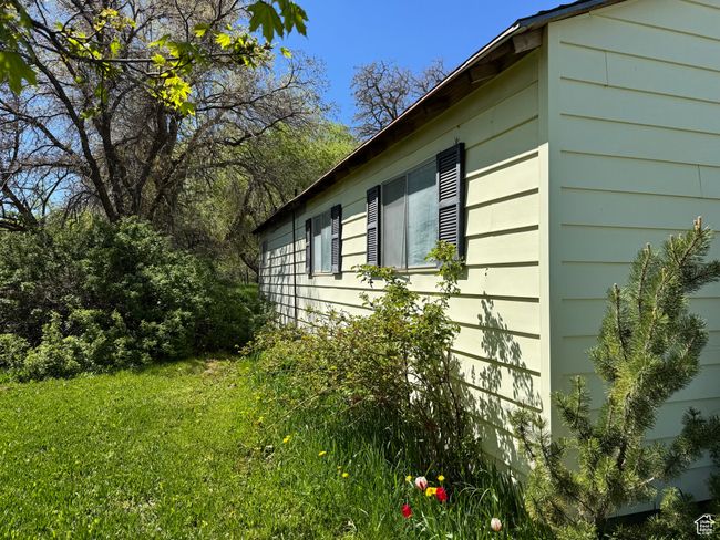 View of property exterior with a yard | Image 28