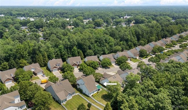 Aerial perspective of suburban area with a forest | Image 47