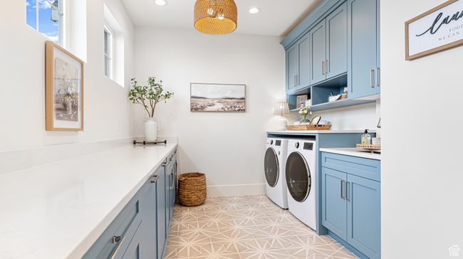 Laundry area with separate washer and dryer, baseboards, recessed lighting, and cabinet space | Image 39