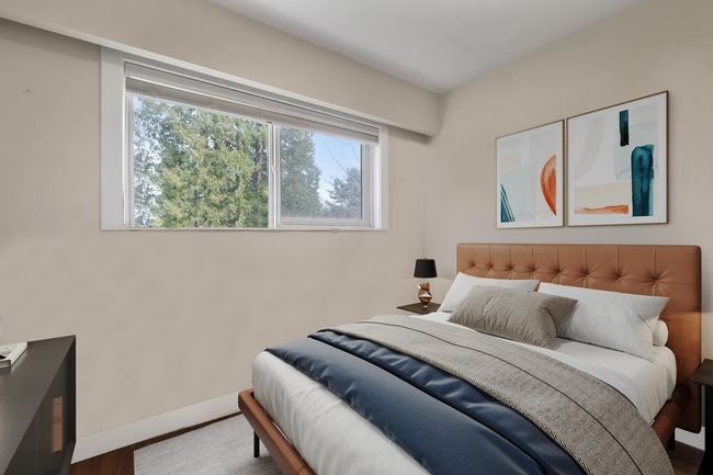 Bedroom featuring baseboards and wood finished floors | Image 10