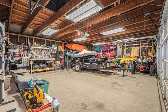 This 3-car detached garage features plenty of space for parking cars and toys! | Image 35