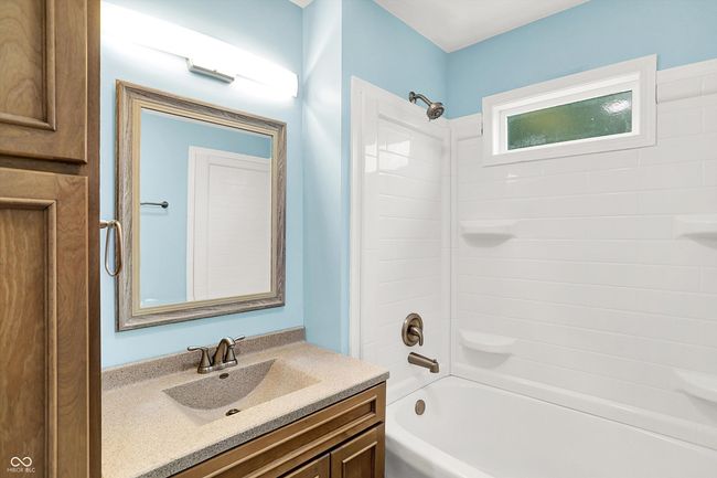 bathroom with vanity and shower / washtub combination | Image 12