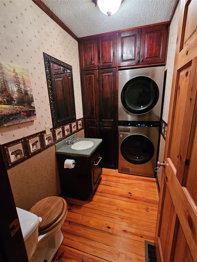 Half Bath with Full- Size Stackable Washer and Dryer | Image 27