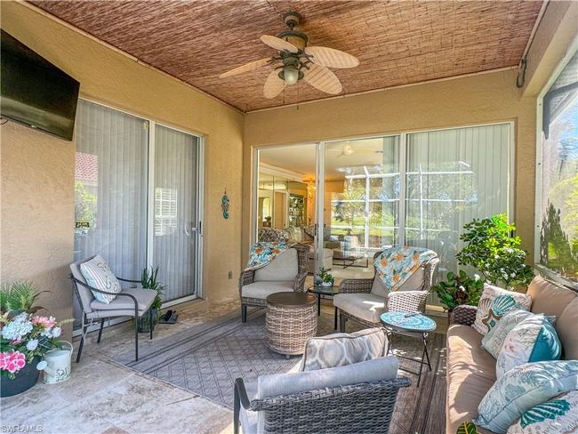 Sunroom / solarium featuring ceiling fan and a healthy amount of sunlight | Image 24