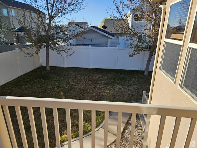 View of yard with a fenced backyard and a balcony | Image 82