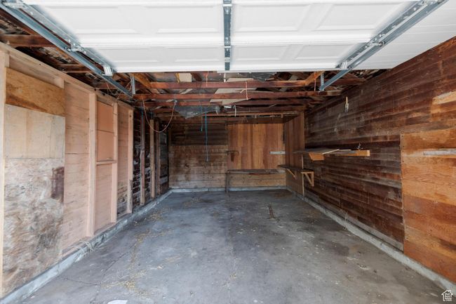 Garage featuring wood walls | Image 18