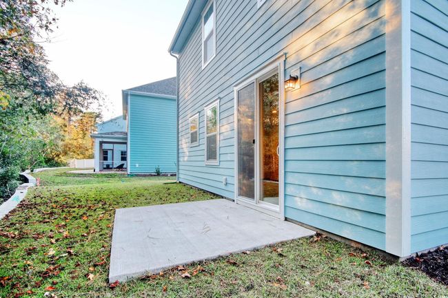 View of home's exterior with a lawn and a patio | Image 18