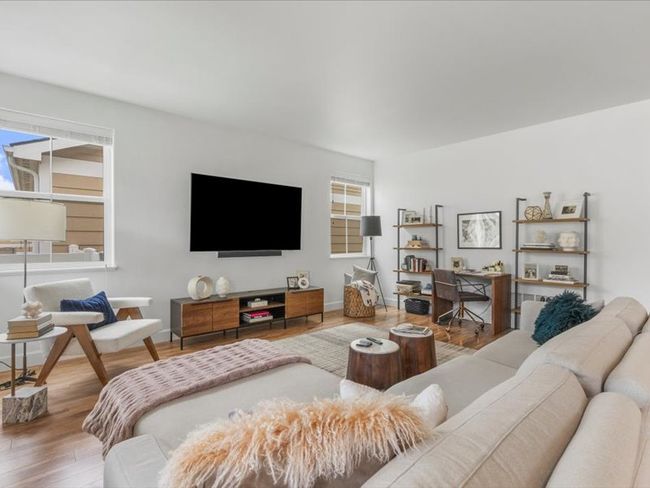 Living area with wood finished floors | Image 4