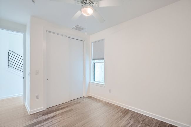 The downstairs bedroom makes for a great home office for guest suite! | Image 10