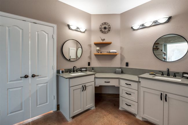 Bathroom with two vanities and concrete flooring | Image 28