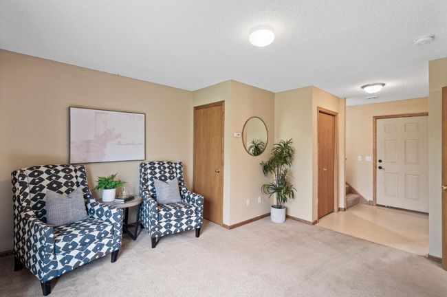 Lower Level Family Room with 1/2 Bathroom and Storage Under The Stairs | Image 16