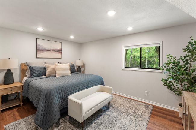 Bedroom featuring baseboards, wood finished floors, and recessed lighting | Image 27