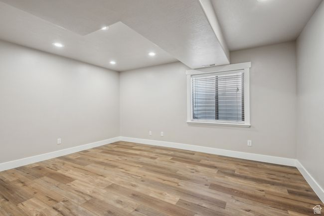 Empty room with light wood-type flooring | Image 36