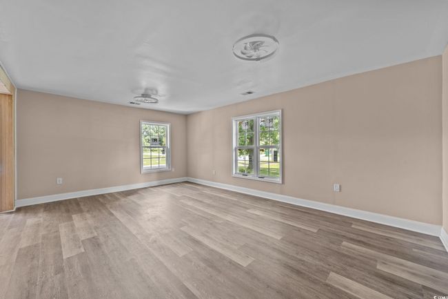 Unfurnished room with wood finished floors | Image 27