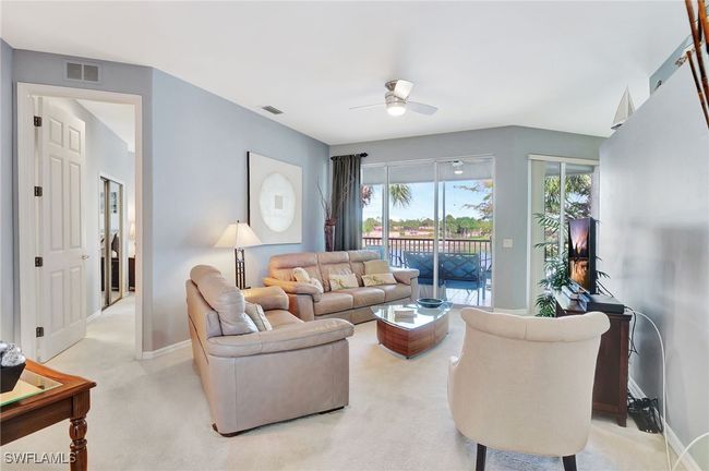 Spacious Living room that opens into the lanai, to enjoy the lovely lake views and wonderful weather durign most months of the year. | Image 10