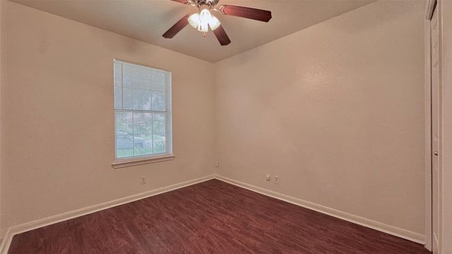 Spare room featuring ceiling fan and closet | Image 14