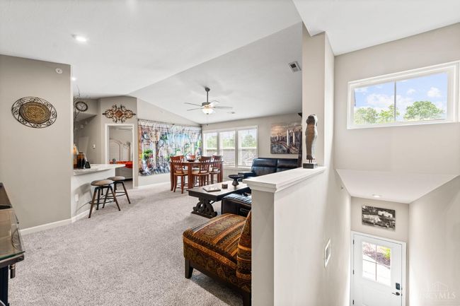View from landing area top of steps. Vaulted ceilings with a bright and airy floor plan for 1, 111 sq feet of living space. | Image 6