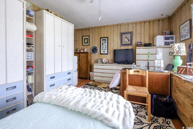 Bedroom with wood walls | Image 17