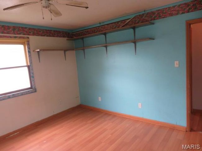 Empty room featuring ceiling fan and hardwood / wood-style flooring | Image 6