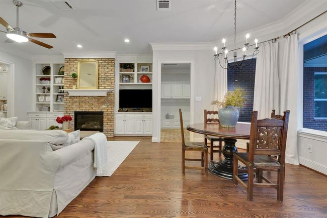 Just off the kitchen, the generously sized breakfast room offers a welcoming space for casual dining. Open to both the kitchen and family room, it enjoys peaceful views of the park-like backyard, creating the perfect spot for morning coffee or relaxed meals with family and friends. | Image 17