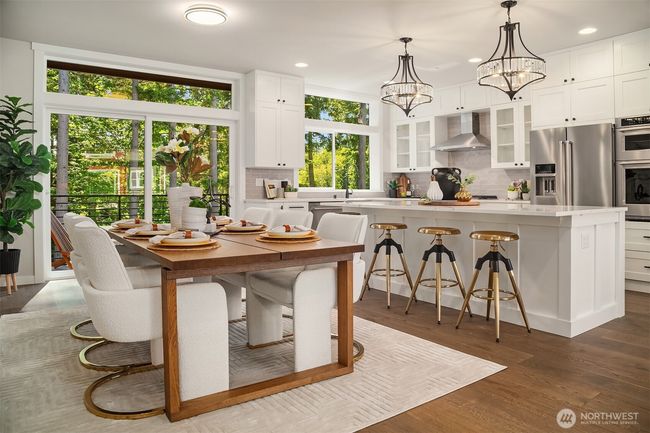 Open-concept kitchen and dining area. | Image 8
