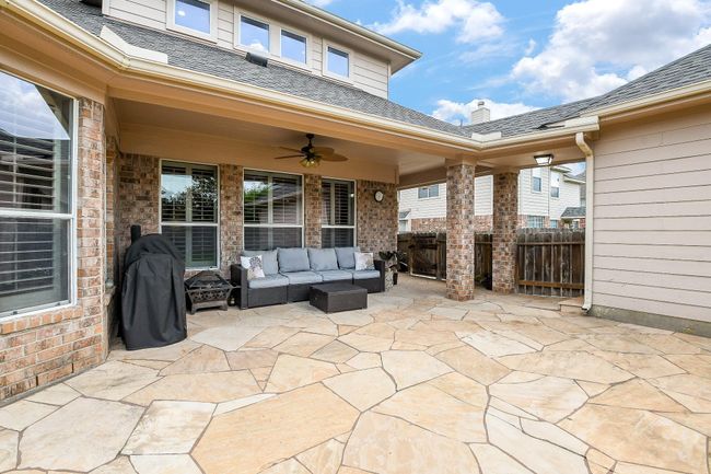 Inviting covered patio with stone paving | Image 46