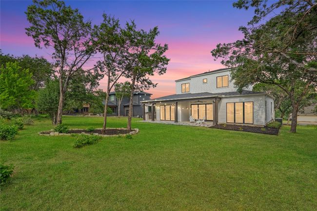 Back of property at dusk with a lawn and a patio | Image 34